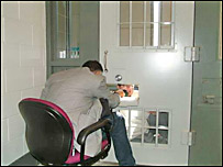 Reporter Anton Foek interviews a high security prisoner.