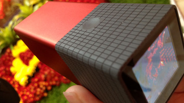 It looks like a squat square red telescope, but is really a camera.