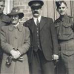 Mr. and Mrs. Stead and two of their sons, outside the North Cemetery Lodge, Bournemouth, during WWII.