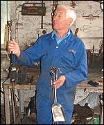 Pic: Michael Harvey admires one of his creations