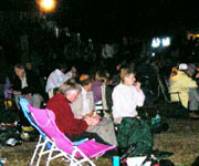 The audience watch on from their deckchairs