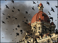 Flames gush out of The Taj Mahal Hotel in Mumbai on November 27, 2008