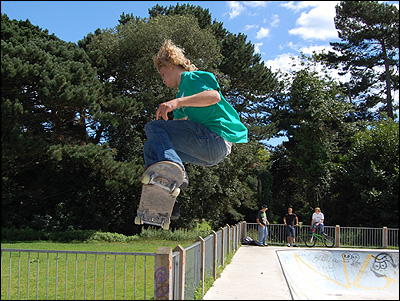 Max performing a streetboarding jump