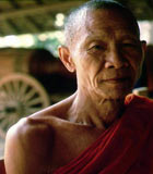 Thai Buddhist monk in a red robe