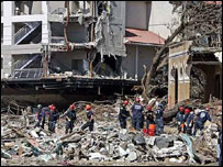 Tackling the devastion. Photo (c) AP