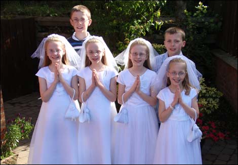 The Turley family on the quads' Holy Communion Day