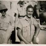 Smudge & Jack Burgin propping up a roving General Grant tank at El Khanka - September 1942. The driver had lost his way and came to ask us where he was.