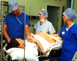 A woman in hospital being prepared for a caesarian section