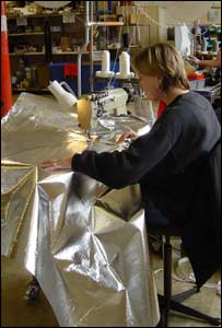 Aileen Davies sewing the silver balloon envelope 