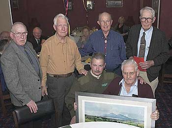 The 'Old Ironsides' receive a painting of the Mourne Mountains, presented by RSM Thompson at BallyKinlar Camp