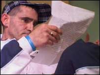 Alan look at one of the letters he's received