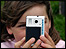 Girl taking photograph