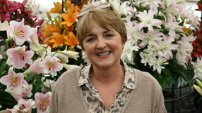Lorainne Hart from Hart's Nursery in front of her gold medal lily display at Tatton 2011
