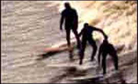 Surfers on the Severn Bore