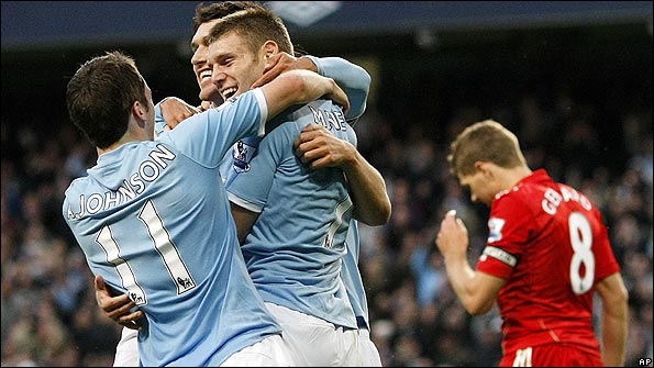 Man City celebrate as Steven Gerrard looks dejected