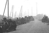 Canadian soldiers at the side of a road near Caen, August 1944