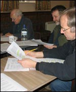 People reading scripts round a table