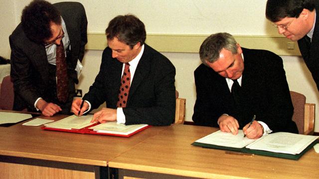 British Prime Minister Tony Blair and Irish Taoiseach Bertie Ahern sign the Good Friday Agreement (Press Association)