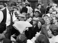 Vendor selling his wares: Eve Arnold
