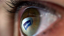 Eye reflecting facebook logo