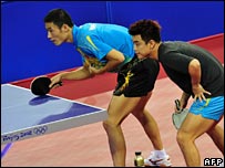China's Wang Liqin and Wang Hao playing table tennis