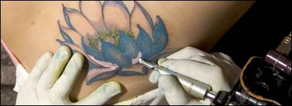  A tattoo being applied on someone’s skin