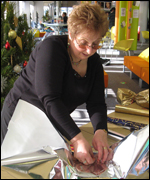 woman wrapping gifts