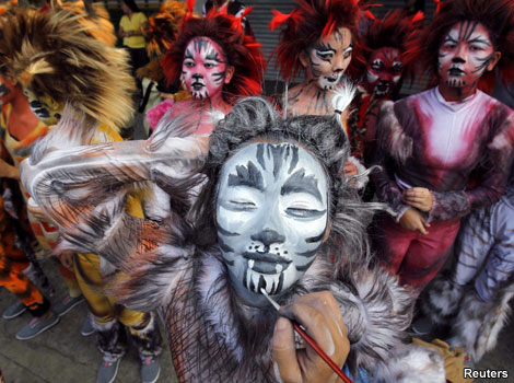 A student taking part in a parade for the Caracol festival in the Philippines