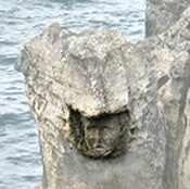 Close-up of carved face.