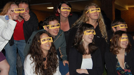Photograph of audience members wearing 2D glasses for a screening of Big Font. Large Spacing