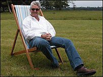 Melvin Benn, director of Festival Republic, reclines in a deck chair.