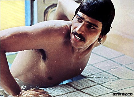 America's Mark Spitz climbs out of the pool after winning the men's 100m butterfly at the 1972 Olympics