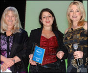 Three women at awards ceremony