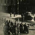 A british armoured car belonging to A Squadron 5 troop 12th Royal Lancers (recce for the Second New Zealand Division). 600 Germans surrendered after Spitfires appeared. I can be seen on the right of the image with my hand held aloft.