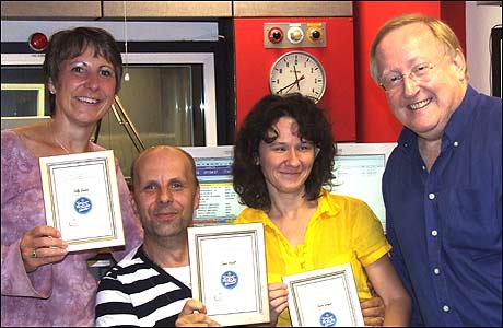 John Mabb (right) presenting the Hazellettes with their Scout badges
