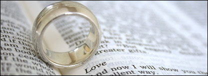 A wedding ring on an open bible