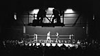 Black and white image of a boxing ring