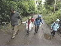 Greg and children walking to school