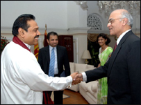 Menon (R) with President Rajapaksa