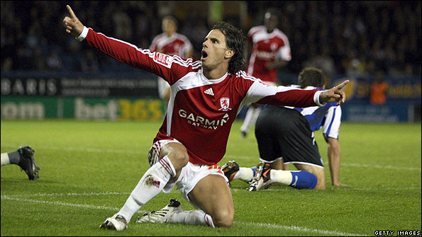 Jeremie Aliadiere celebrates after scoring against Sheffield Wednesday
