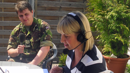 Lance Corporal Davies takes his turn with Louise and the microphone