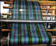 Tartan being made int he traditional fashion.
