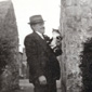 Anne's Grandfather Joe Campbell with Toots the cat. The picture was taken at the back of Anne's Grandparents house.