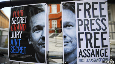 Afiche con la imagen de Julian Assange