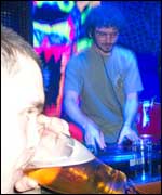 man with beer and DJ