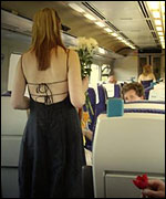 Girl carrying flowers on a train