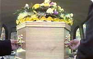 Coffin with flowers on top