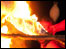Torches being lit at Beltane Fire Festival. Photo by Duncan MacGregor.