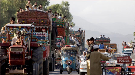 Internally Displaced Persons (IDPs) travel by road as they flee military operations in Swat, Buner and Lower Dir on May 10, 2009 in Malakand, Pakistan