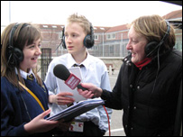 Beth speaks to Huw Edwards via the radio car